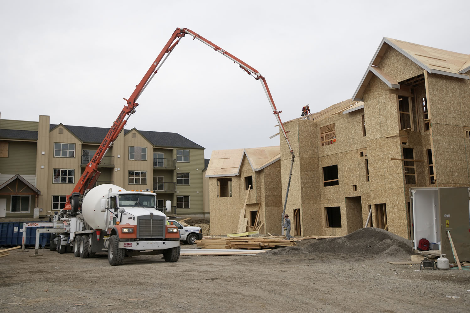 A Presto Homes worker builds a roof Tuesday at the Timbers at Towne Center in Hazel Dell.