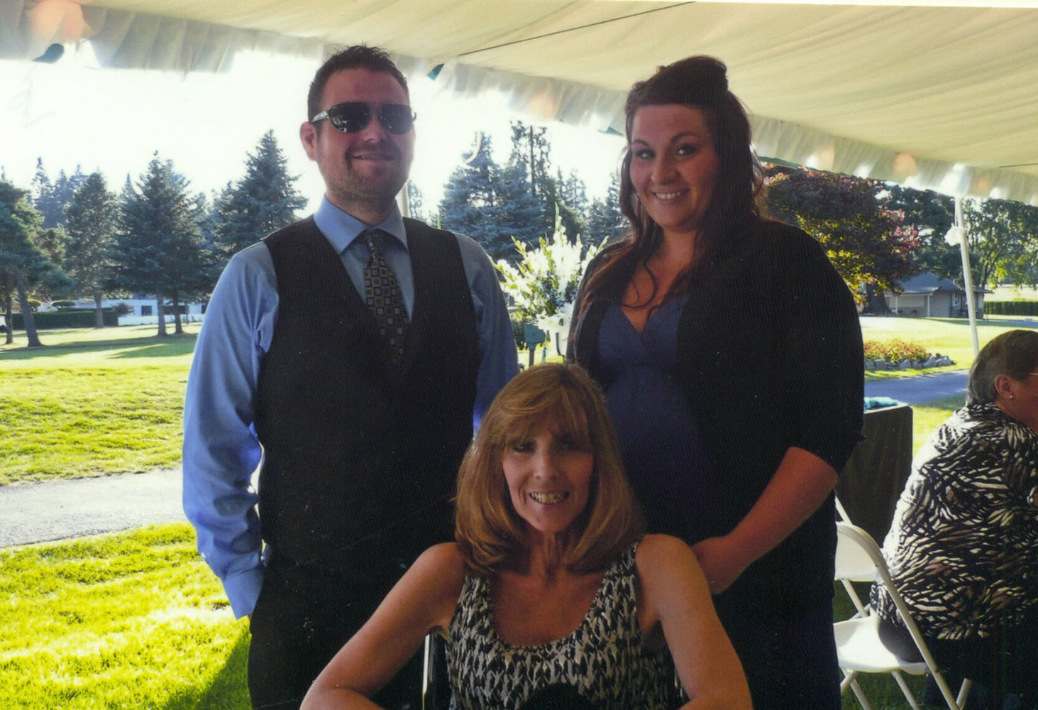Luke Ashe attends a July wedding with his sister, Sarah Ashe, right, and mother, Gwenn Ashe.