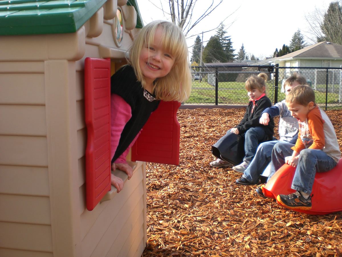 Washougal: Gause Elementary preschoolers, from left, Emerson Fletcher, Paige Ladd, Tanner Kneipp and Jayden Vasquez enjoy a newly improved play area.
