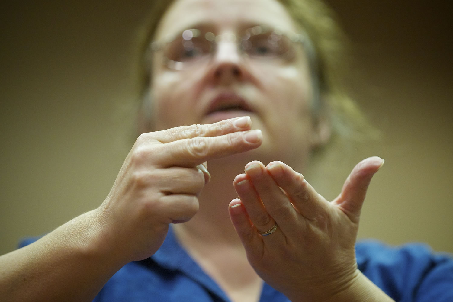 Ann Reazin interprets song lyrics in American Sign Language.
