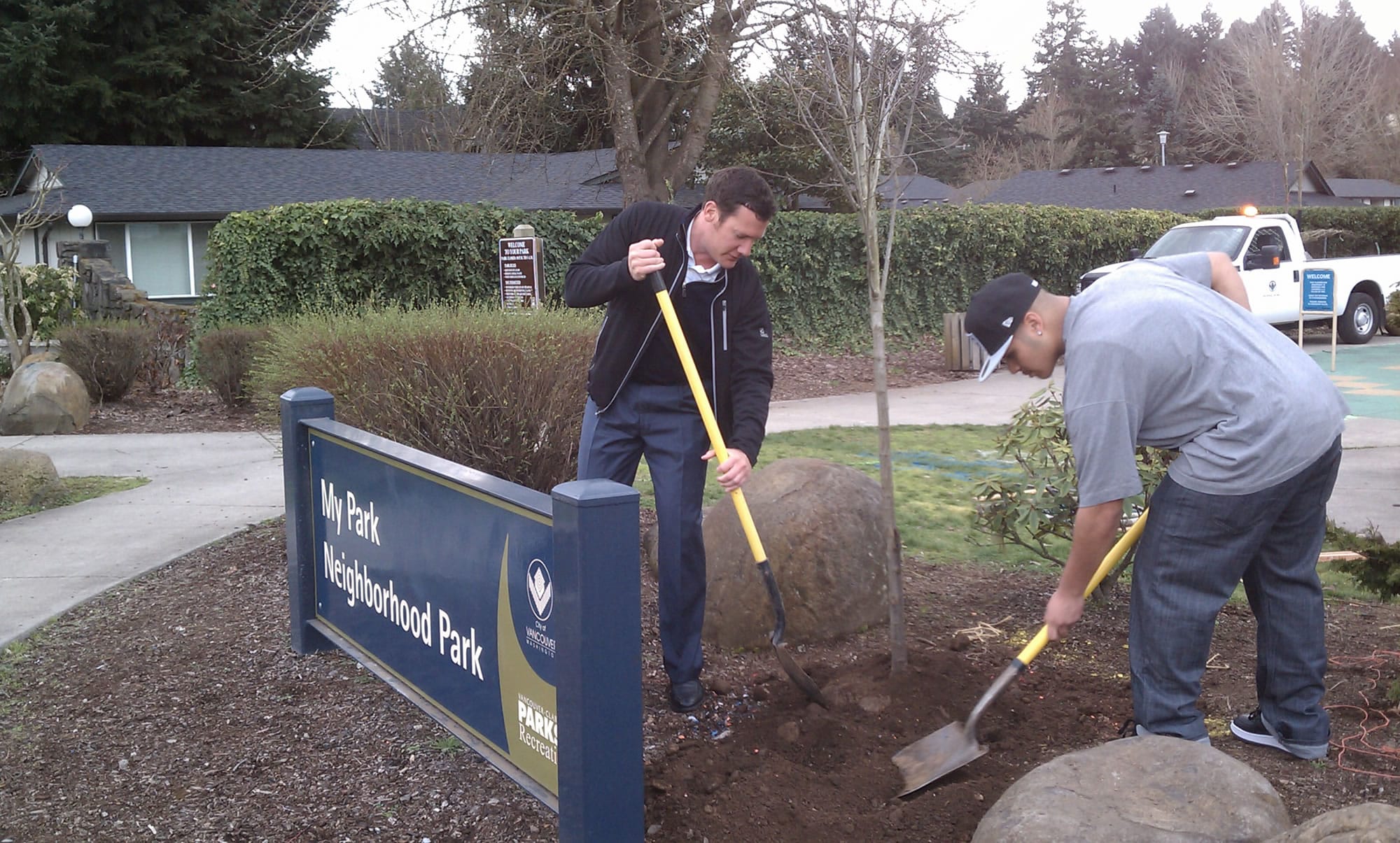 Maplewood: Shooting victim Jose Reyes, right, helps Mayor Tim Leavitt plant a tree in Mypark on March 15.