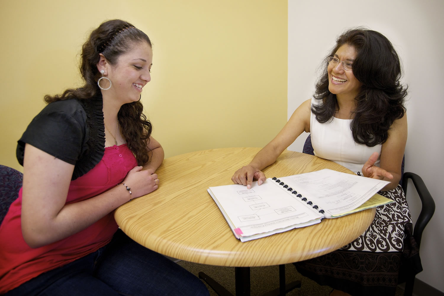 Rosalba Pitkin, right, counsels Julie Mercado, a second-year student at Clark College. Pitkin is an Aztec-Mexican who immigrated to the United States and has played a pivotal role on the State Commission on Hispanic Affairs. In her day job, she helps international students at Clark College adjust to the U.S.