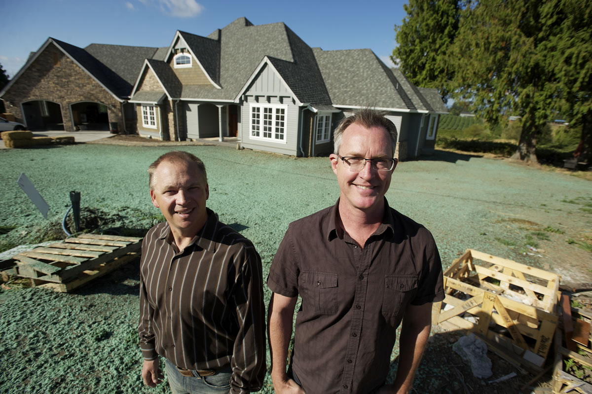 Brent Harrison, left, and Matthew Clarkson of Camas-based Soaring Eagle Homes went from building high-end custom homes to doing odd jobs to survive the housing industry downturn.