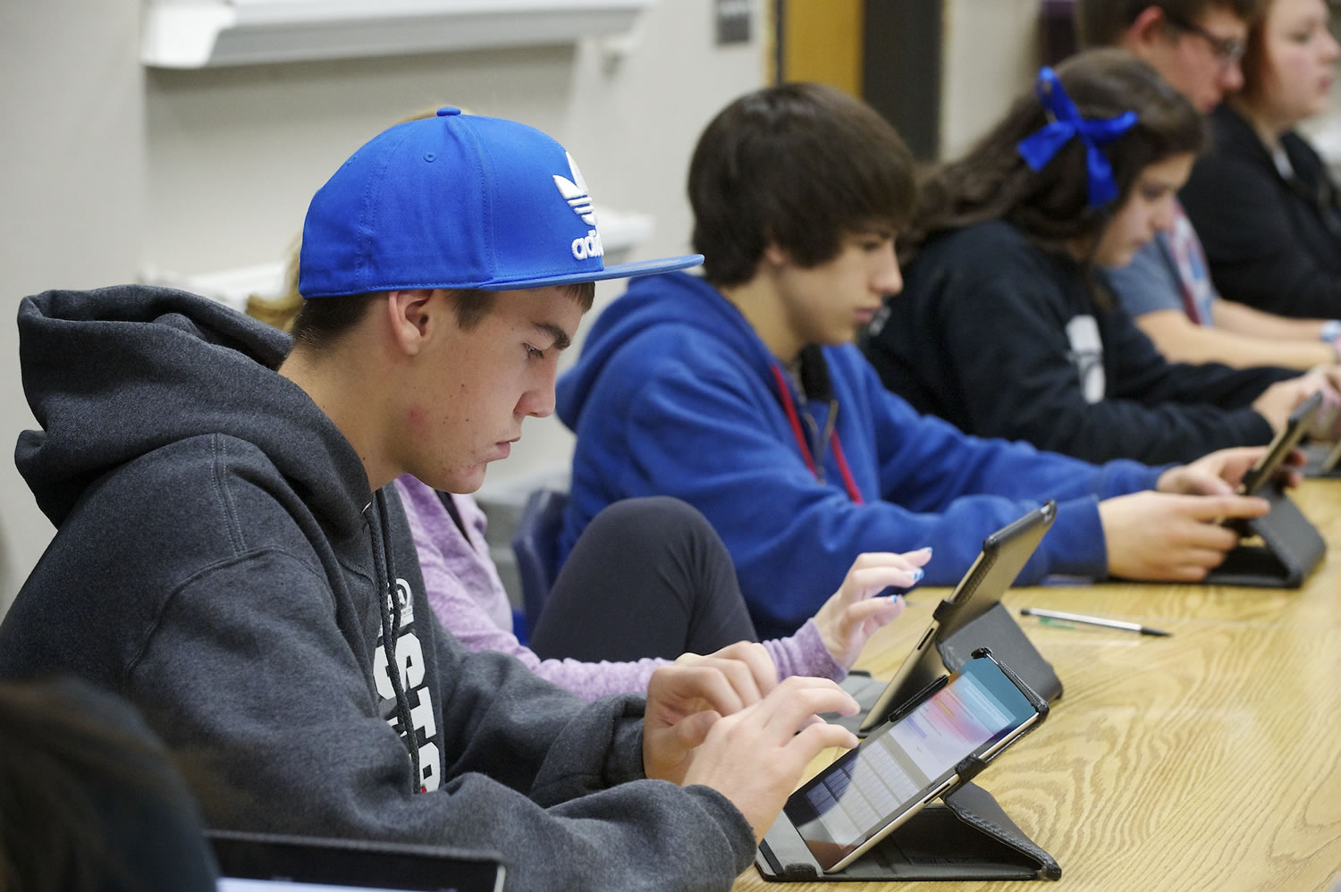 La Center High School student Alex Firl, 15, takes an assessment exam in Spanish class using an iPad Friday.