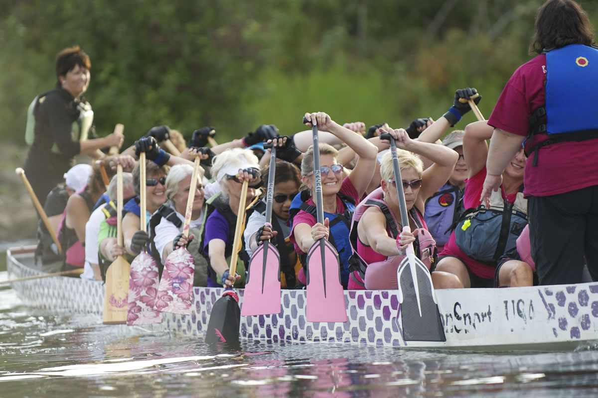 Members of the Pink Phoenix dragon boat team practice on the Willamette River near RiverPlace Marina in Portland on Aug. 7.