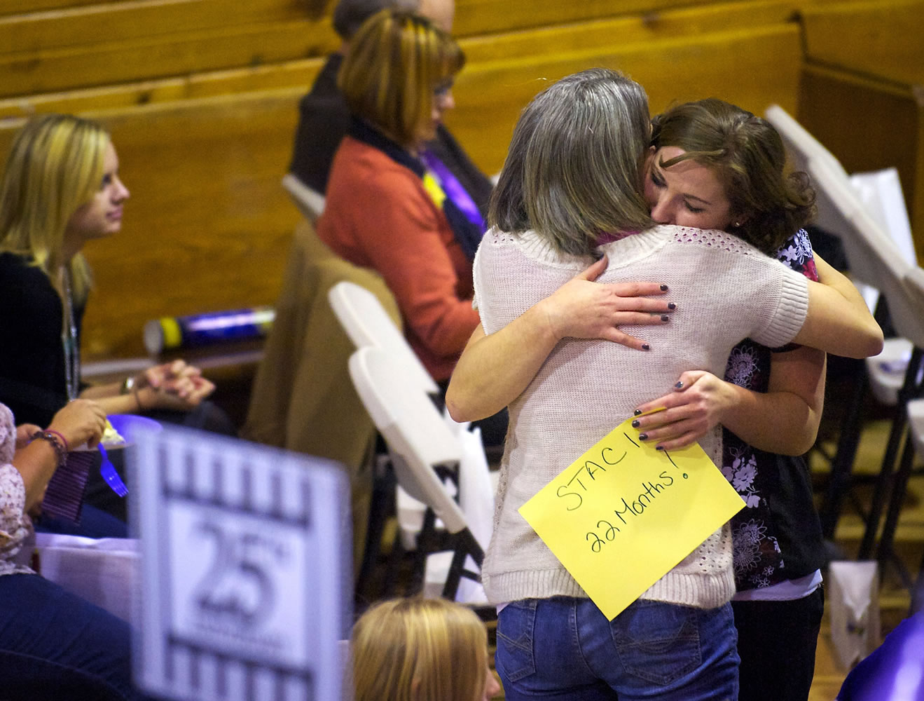 Staci Harrington, 32, right, of Vancouver, hugs her sister, Nikki Fountain, 39, during the Vancouver Relay for Life kickoff rally Thursday at St. John Lutheran Church. Harrington was diagnosed with non-Hodgkin lymphoma 22 months ago.