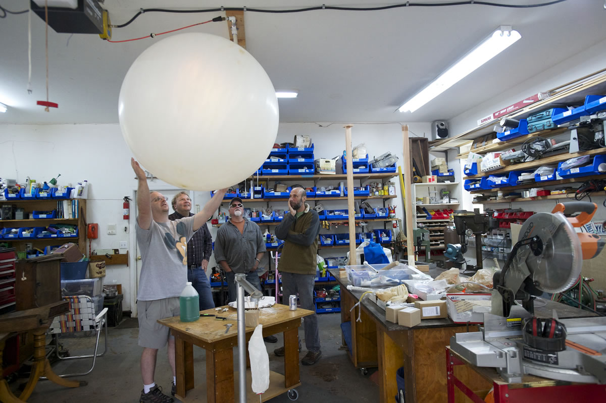Joe Barbera, right, with team members, from left, James Sutherland, Kevin Cyrus and Rich Sutherland, plans to use weather balloons to launch himself in a lawn chair.