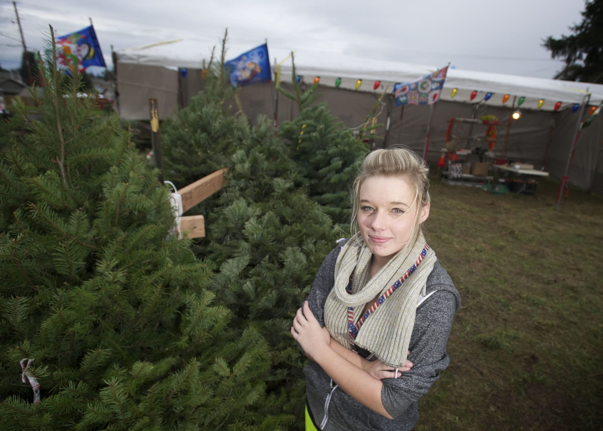 Kaitlyn Metscher, 16, operates a Christmas tree lot to help her save money for college.