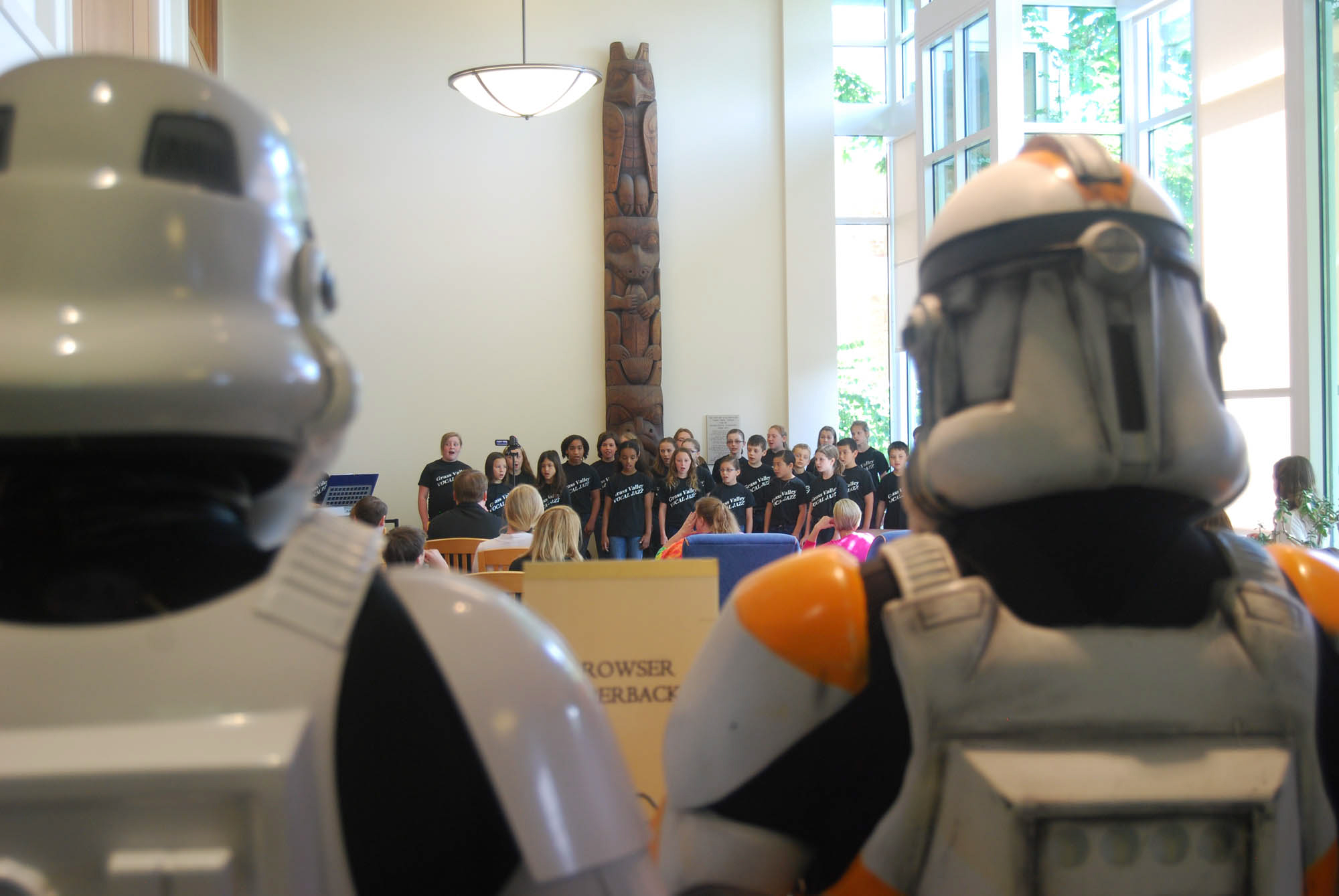 Camas: Members of Oregon and Southwest Washington's Cloud City Garrison, a chapter of the 501st Legion of Stormtroopers Star Wars Imperial costuming club, watch a performance by the Liberty Middle School Jazz Choir May 11 at the Camas Public Library 90th anniversary celebration.