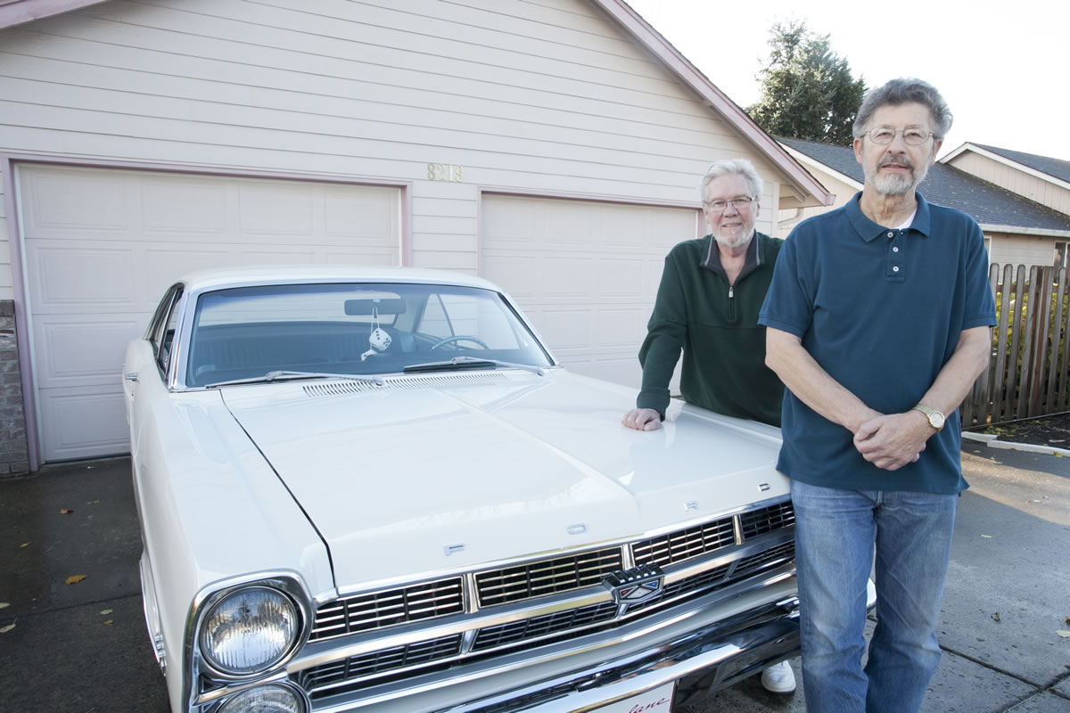 Mike Woods, left, looked at a 1967 Ford Fairlane at a summer cruise-in and found it was owned by Jim Chmielewski, an Army buddy he last saw in 1966.
