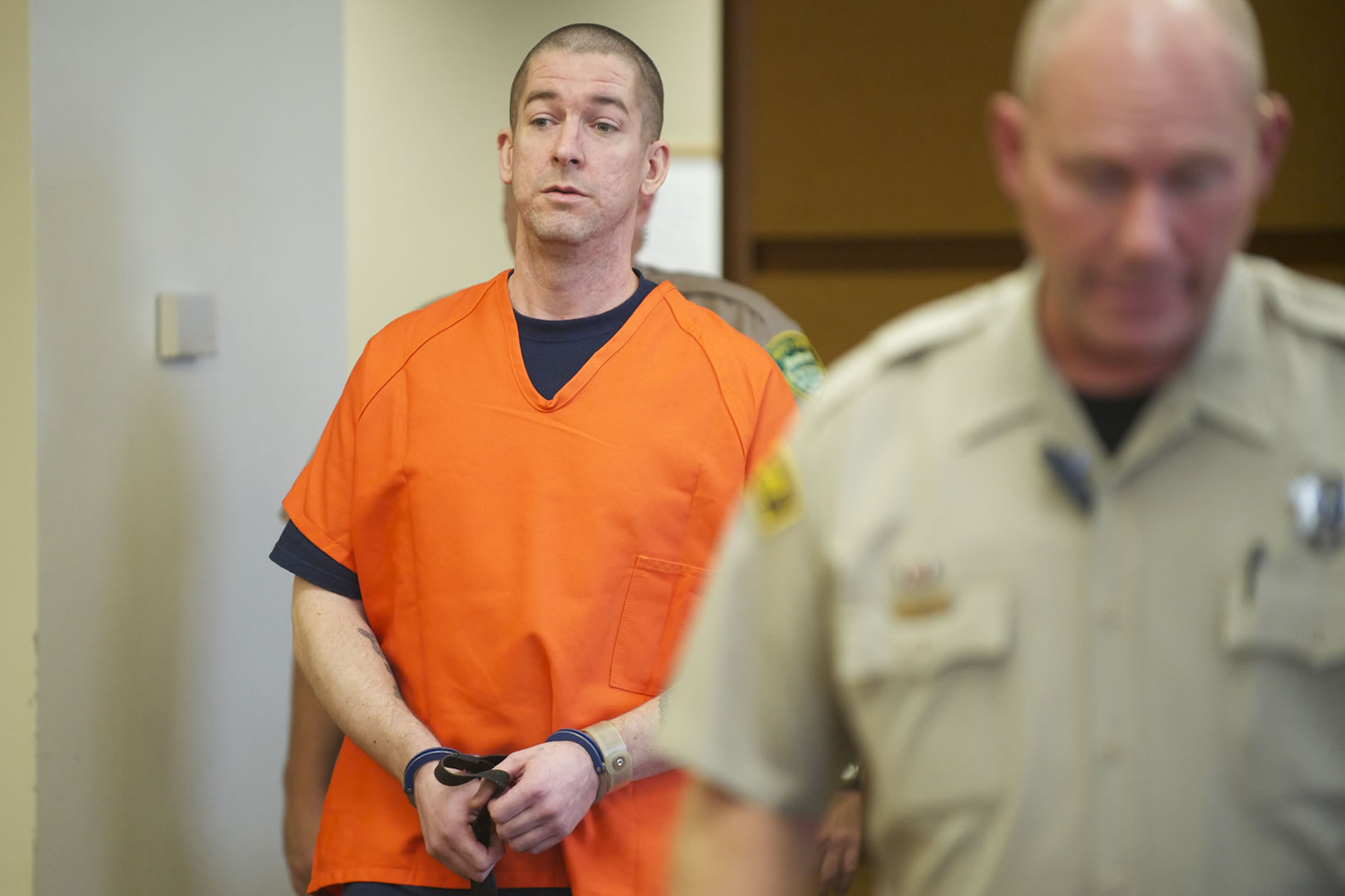 Mitchell O'Brien is escorted into Clark County Superior Court Judge John Nichols' courtroom to be sentenced for the June 2011 murder of Deneace L. McSpadden of Vancouver.