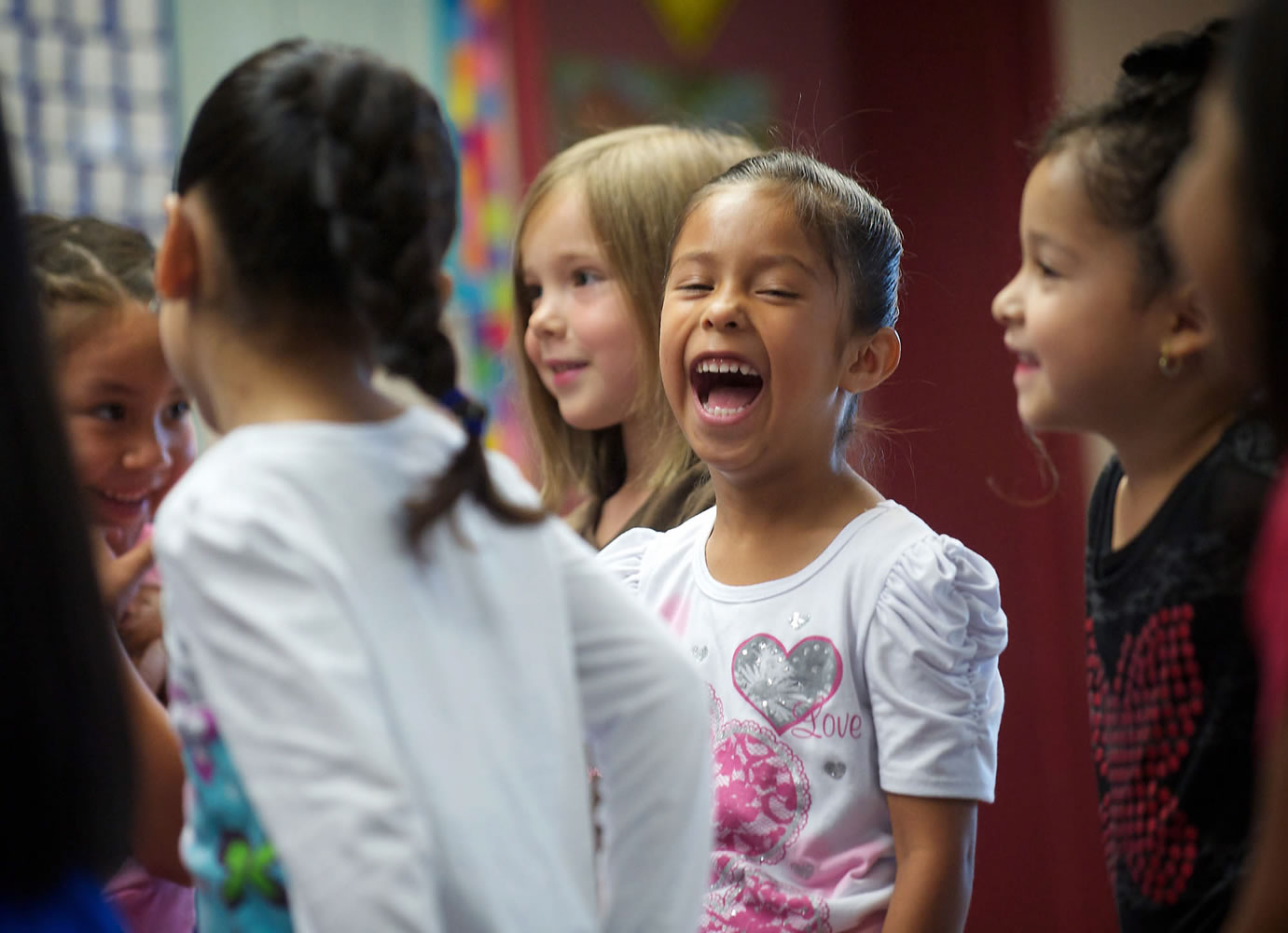 Kindergartner Ashly Prado Virelas, center, is one of about 500 students in Vancouver who went to school a few weeks early under the Jump Start program last summer.