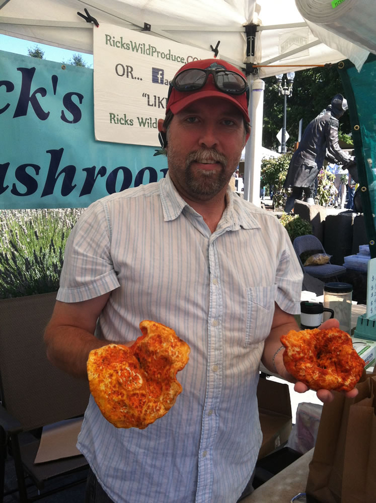 Rick Pine of Rick's Wild Mushrooms at the Vancouver Farmers Market holds lobster mushrooms.