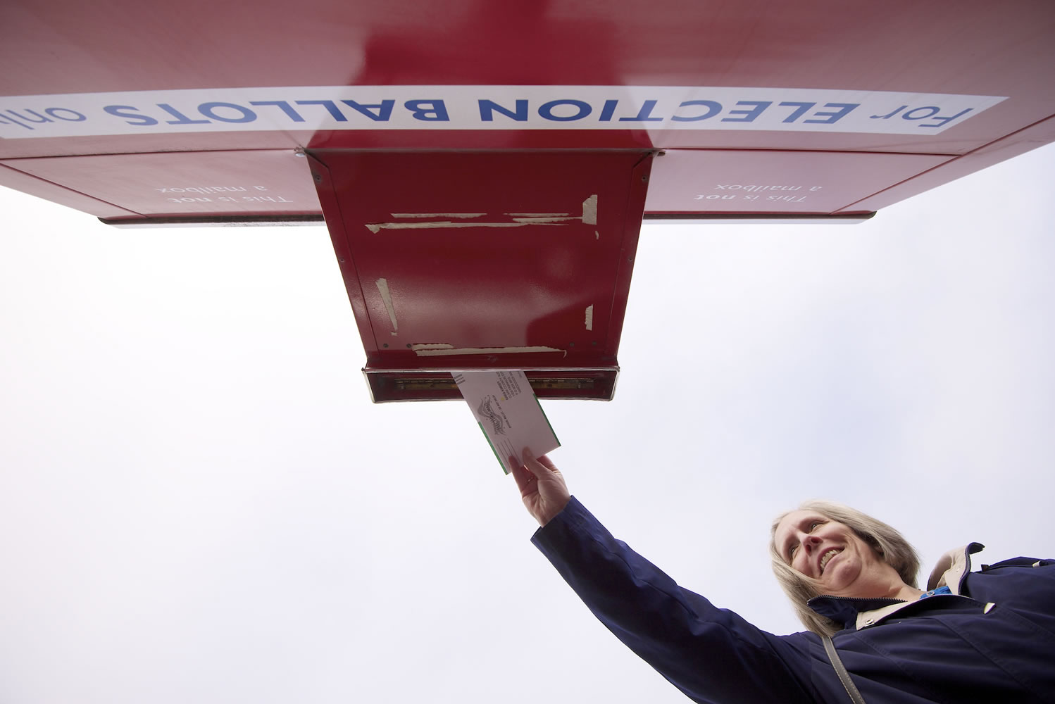Sandy Wozny of Vancouver places her ballot in a drop box near the Clark County Elections Department prior to last year's general election.