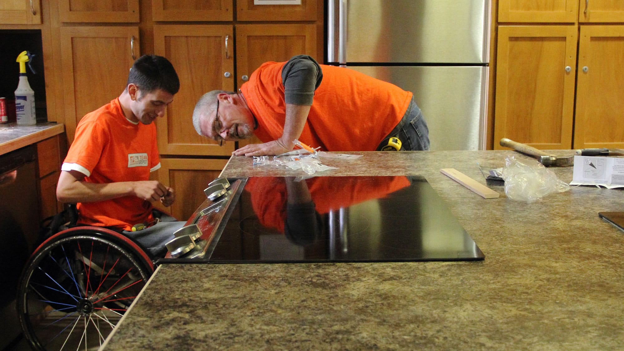 Central Park Place: Employees with &quot;Team Depot&quot; install new countertops at the apartment building for homeless veterans and others.