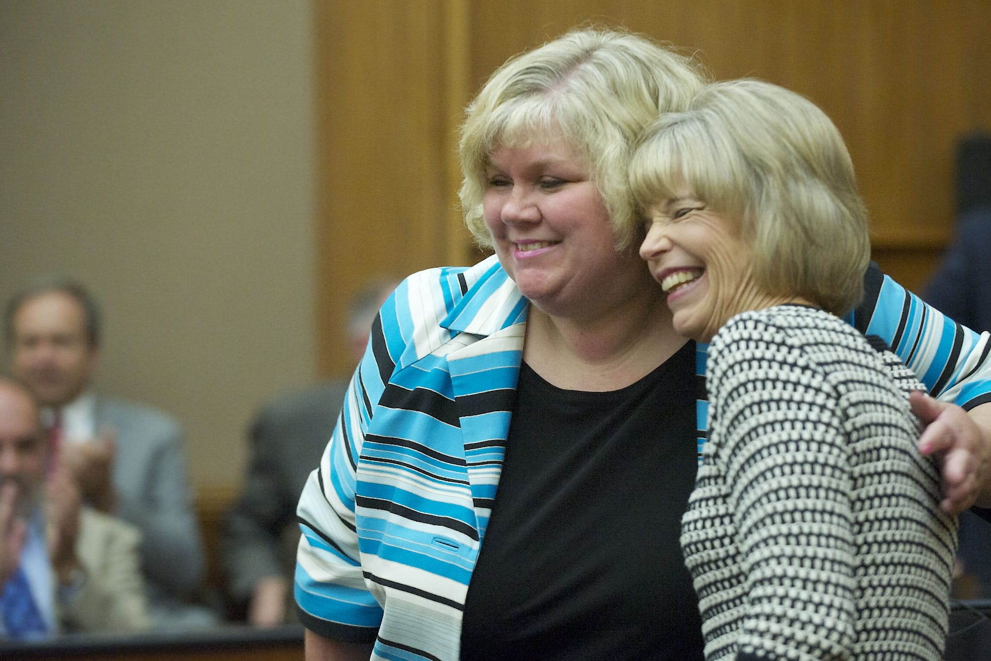 Clark County Superior Court Judge Barbara Johnson,right, hugs Vancouver attorney Suzan L. Clark on May 6 after Gov. Jay Inslee appointed Clark as the next Superior Court judge.