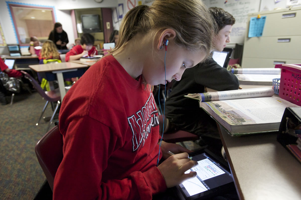 McLoughlin Middle School student Katie Johnson uses an iPad in Monica Hughey's sixth grade class.
