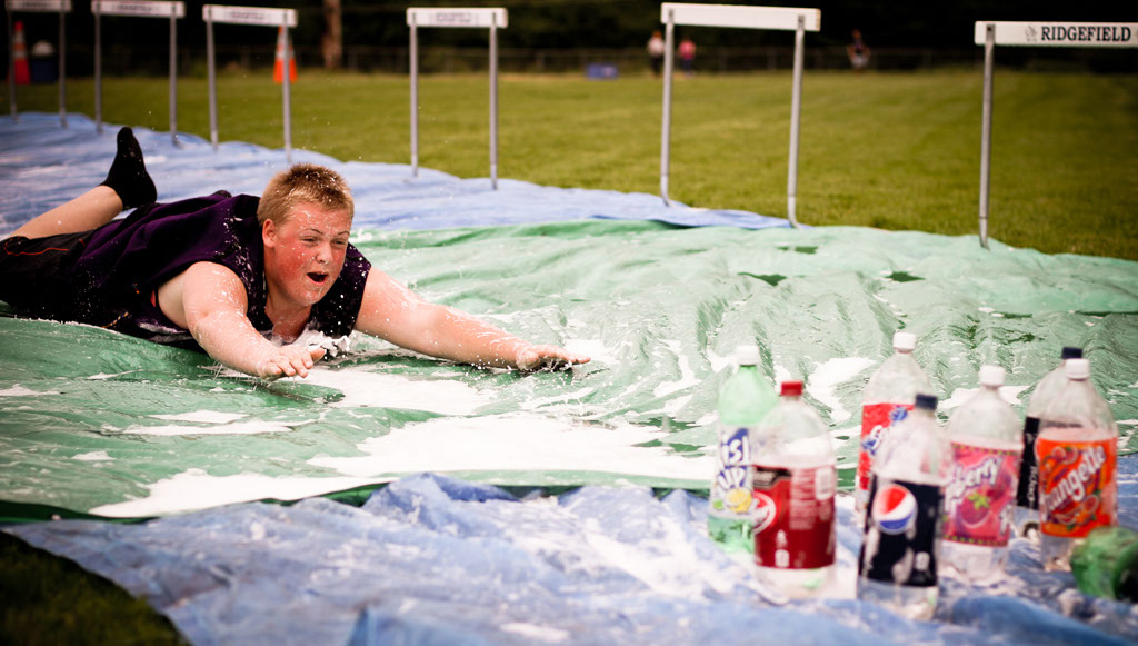 Ridgefield: Macauly Preuss, then a sophomore, demonstrates Olympic greatness in the Human Bowling event.