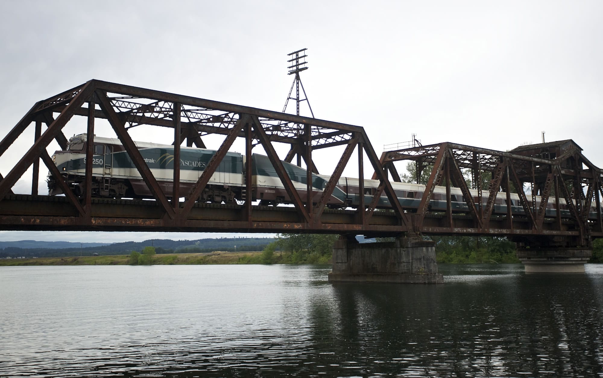 A southbound Amtrak crosses a railroad bridge over the Lewis River near Woodland on Thursday.
