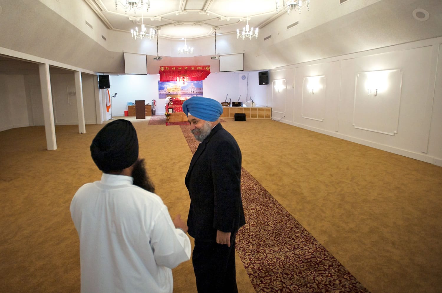 Jagjit Prehar Singh, right, talks to Sukwinder Singh inside Gurudwara Sahib Vancouver.