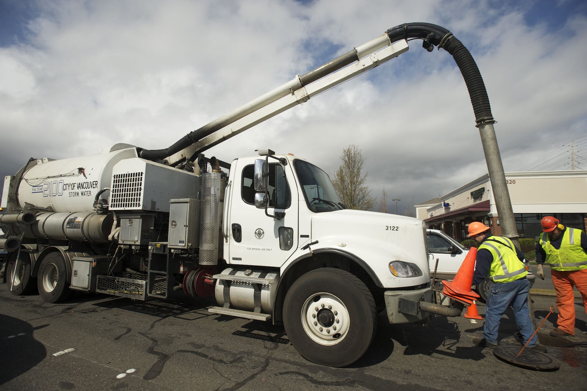 A City of Vancouver  crew uses a Vactor truck to clean storm drains on Mill Plain Boulevard.