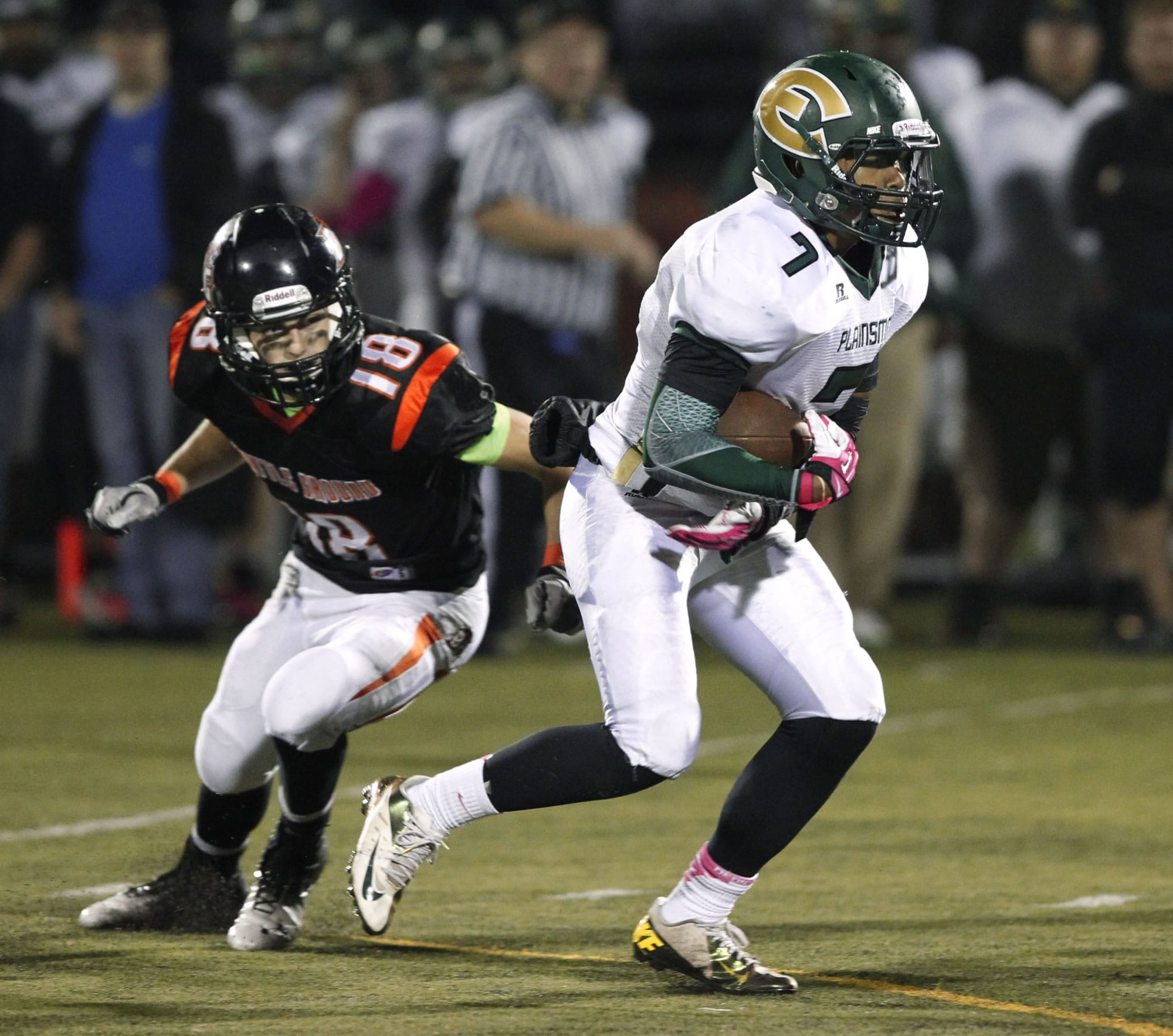 Evergreen running back Rey Green (7) escapes tackle by Battle Ground defensive back Josh Lemar in 4A GSHL opener.