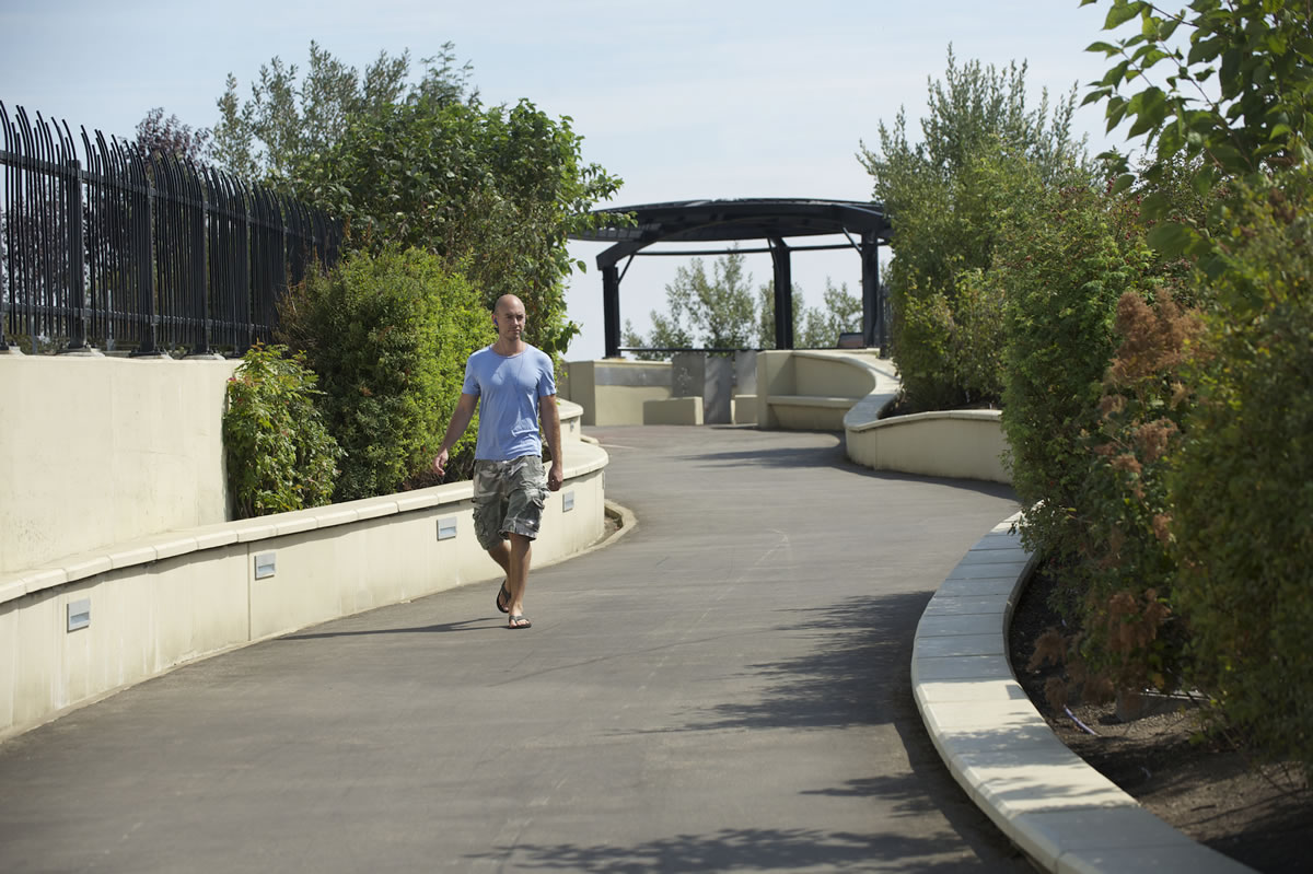 Cameron Van Blokland of Vancouver walks Wednesday along the Vancouver Land Bridge.
