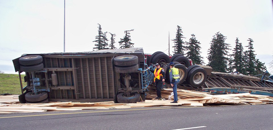 A lumber truck overturned on the ramp from state Highway 14 to Interstate 205 southbound Friday afternoon causing traffic in the area to backup.