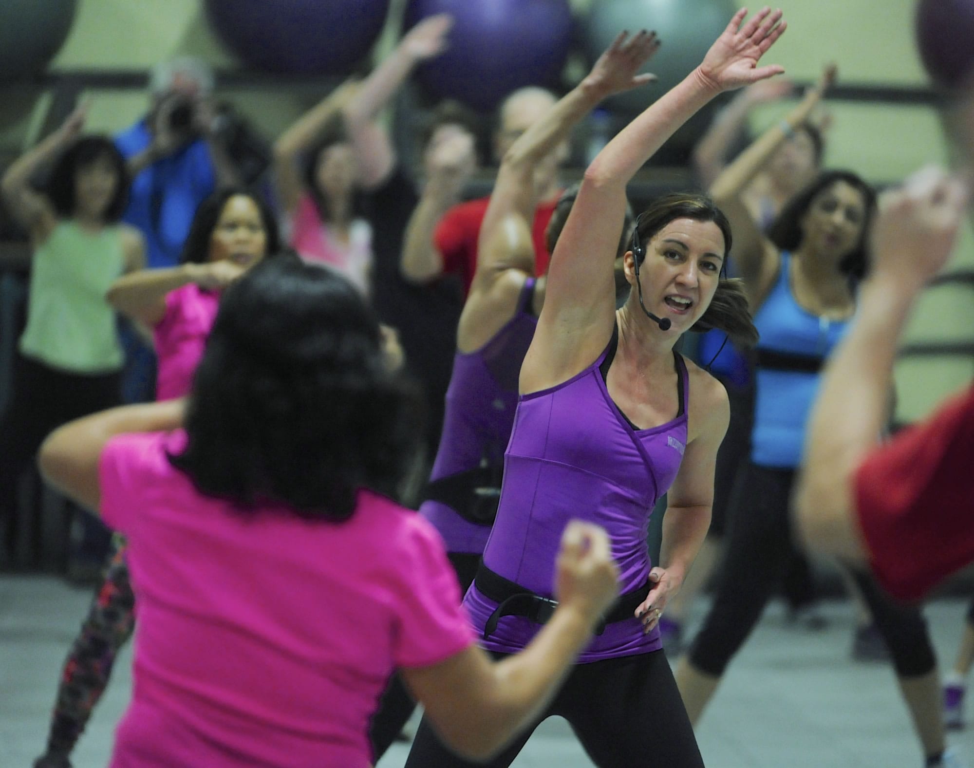 Jazzercise instructor Lisa Ackerman leads about 35 people through a class at LaCamas Swim &amp; Sport in Camas Wednesday.