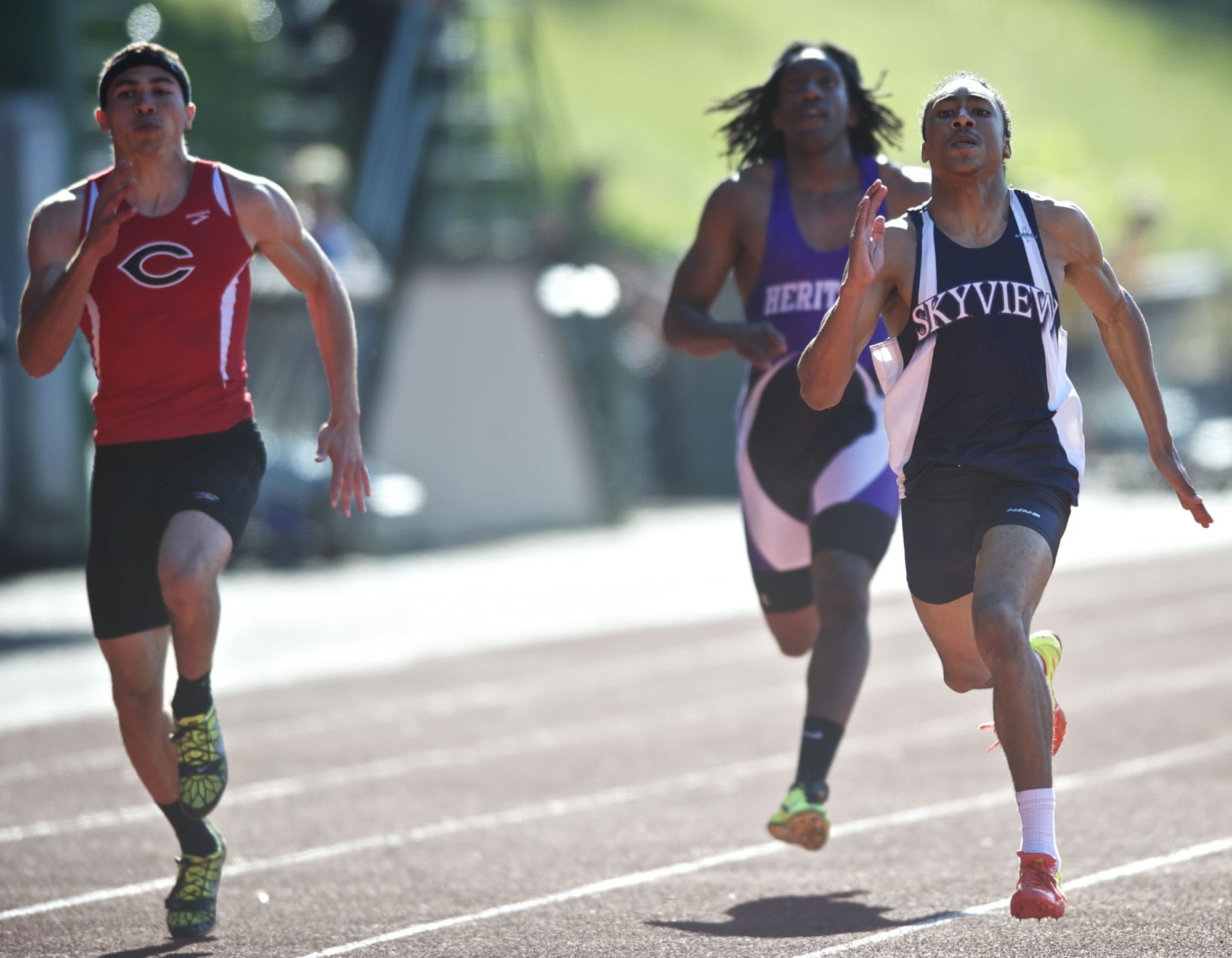 Skyview senior Kevin Washington, right, finishes first in the 4A boys 200 meters.