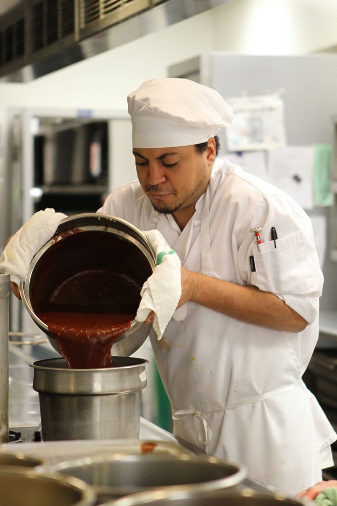 Clark College culinary arts student Louis Cayson prepares tomato soup during lunch last week in the cafeteria's kitchen.