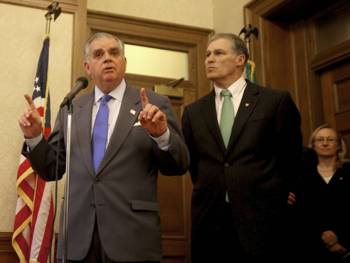 U.S. Transportation Secretary Ray LaHood, right, emphasizes the need for funding commitment for the Columbia River Crossing by the Washington state Legislature during a visit to Olympia on Wednesday. At left is Washington Gov.