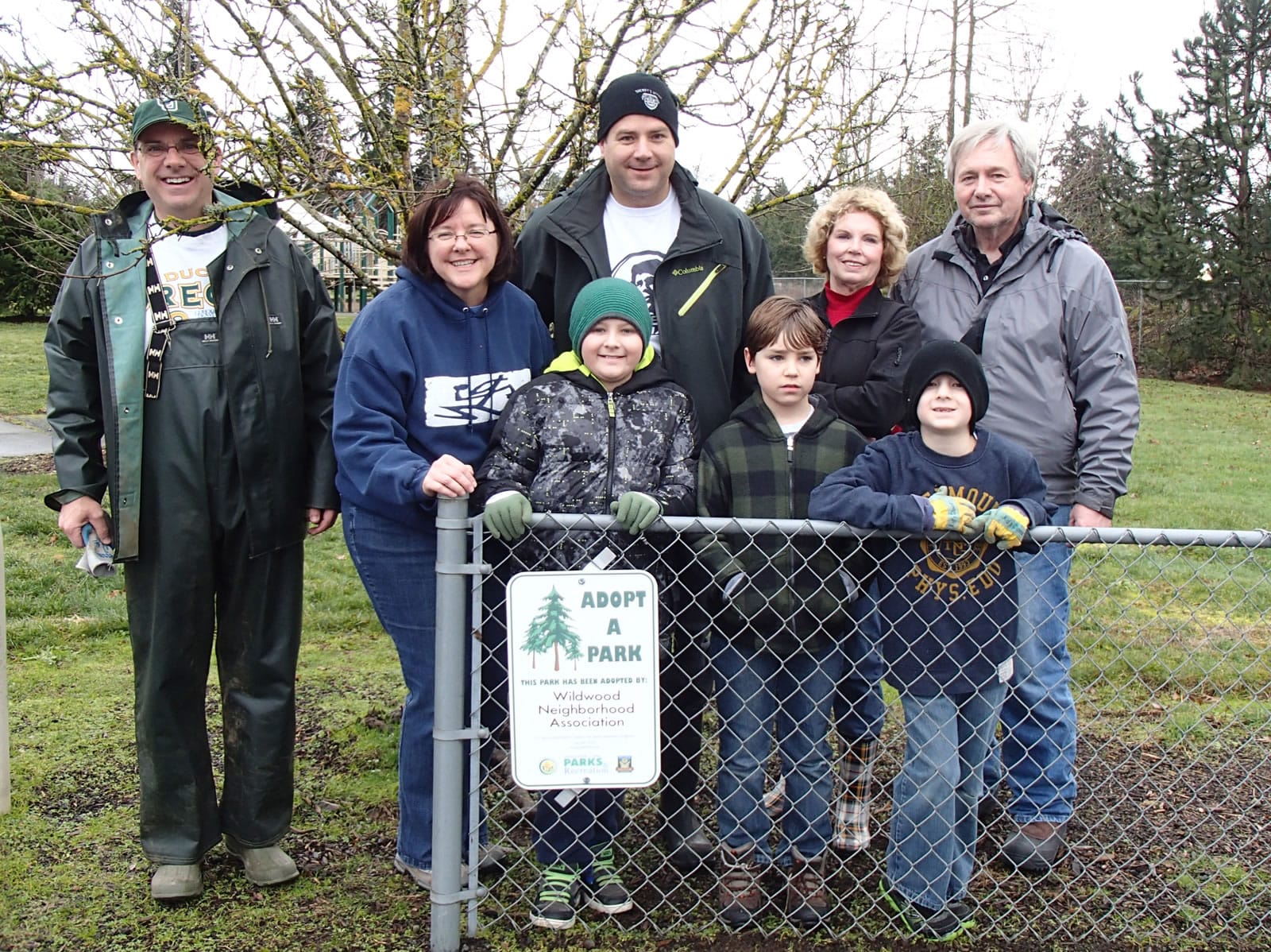 Volunteers from the Wildwood Neighborhood Association gather around the new Adopt-a-Park sign at the Wildwood Neighborhood Park in Vancouver. From rear left are John Gray, Judi Bailey, Shane Gardner, Charlotte Lamb and Charles Lamb. From front left are Kaden Gardner, Jack Nagel and Elias Gardner.