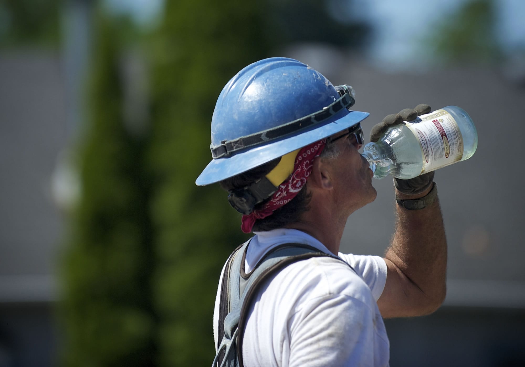 Carpenter Tom Richards stops for water while working on the St. Johns Boulevard bridge at state Highway 500 on Friday, the sixth straight day above 90 degrees in Vancouver.