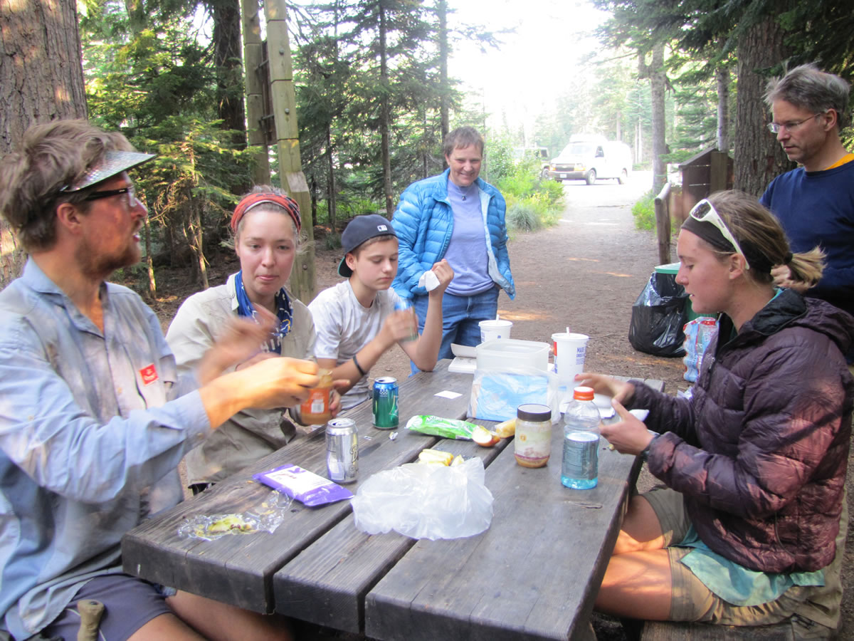 The hikers stop to refuel at Frog Lake near Mount Hood. PCT hikers can consume 4,000 or more calories per day.