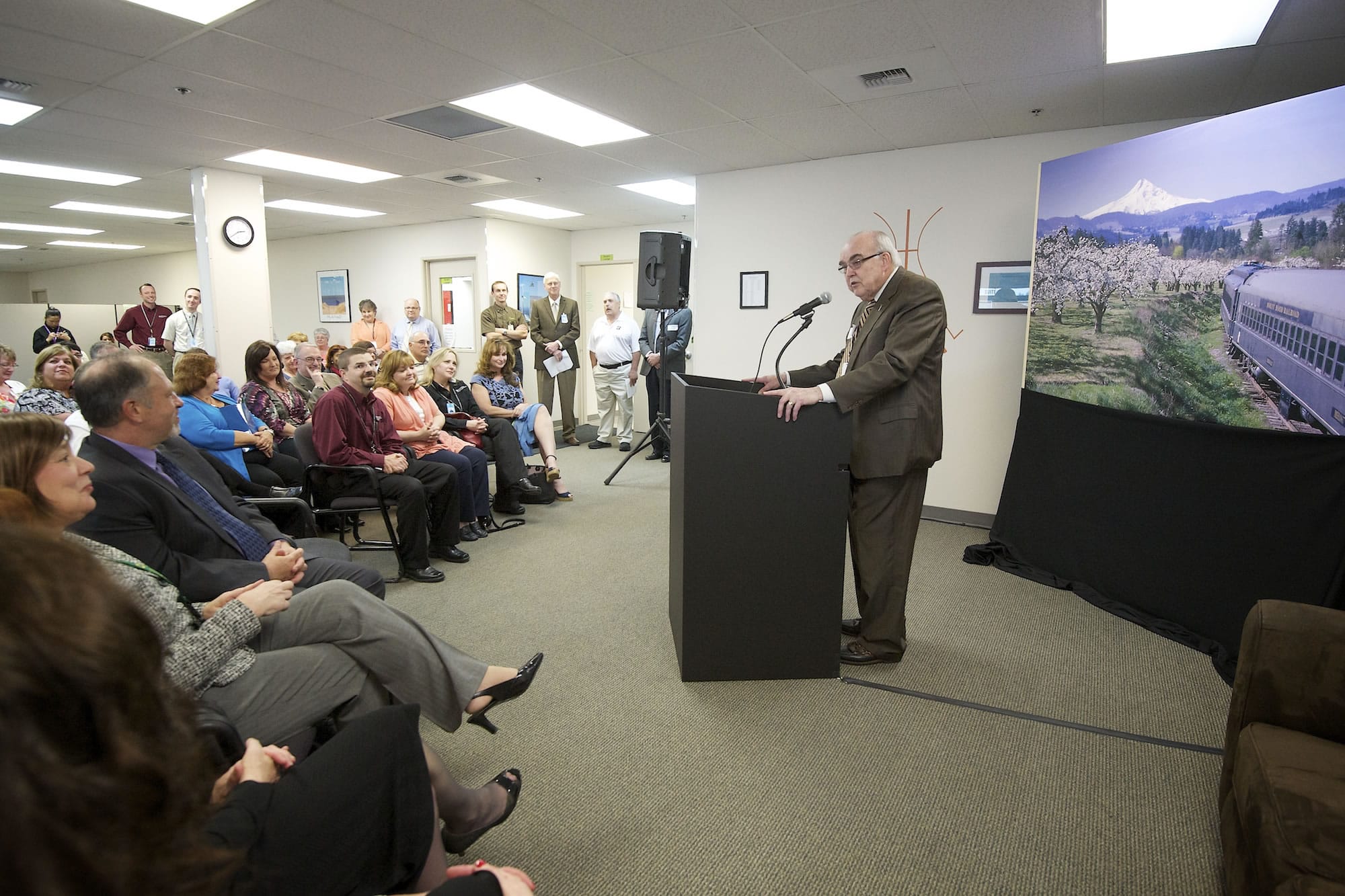 Arch Miller, founder and CEO of the International Air and Hospitality Academy in Vancouver, announces the new Northwest Railroad Institute program during a Tuesday news conference.