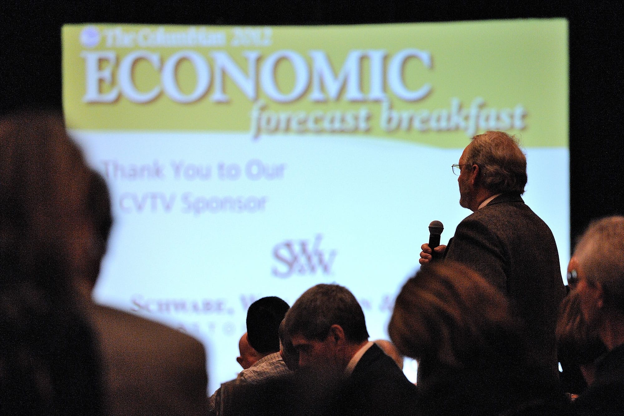 A guest asks a question of keynote speaker, Dr. John C. Williams, president and CEO of Federal Reserve Bank of San Francisco, at The Columbian's 2012 Economic Forecast breakfast on Jan. 10, 2012, at the Hilton Vancouver Washington. The 2013 edition of the event will be held Jan.