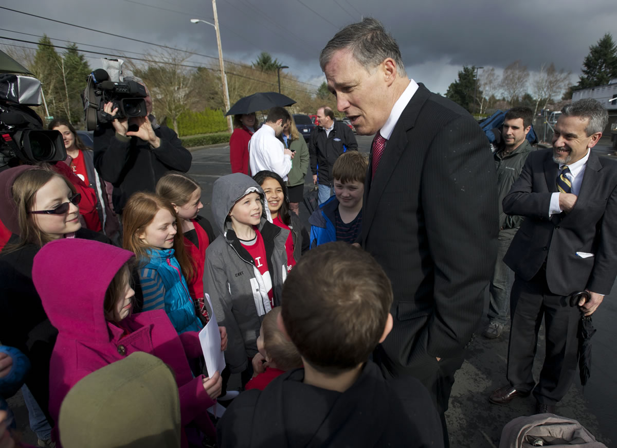 Payton Rush, 9, wearing a gray hooded coat and a red T-shirt, and other Crestline fourth-graders meet Gov.