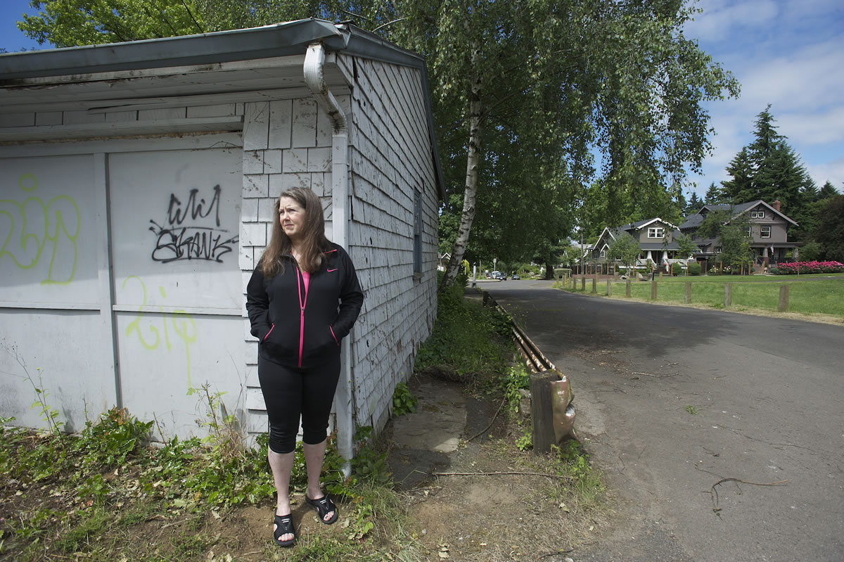Suze Marshall, who lives in west Vancouver's Arnada neighborhood, stands next to her detached garage, which was broken into in May 2012.