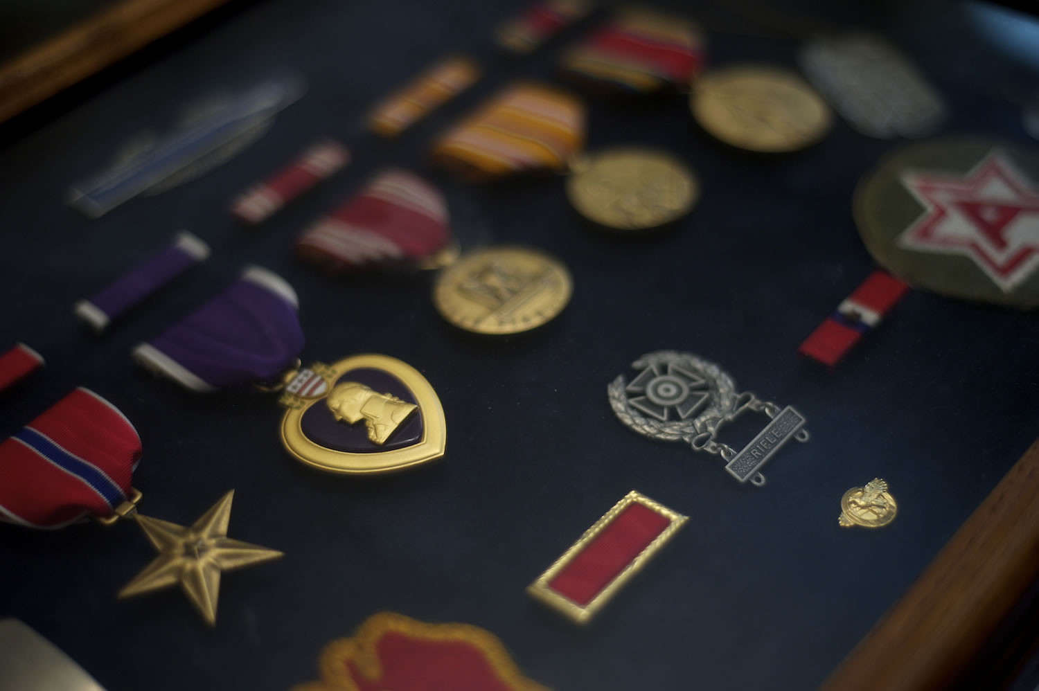 Carl Wunder preserves the decorations he earned while serving in the Army's 25th Infantry Division -- &quot;Tropic Lightning&quot; -- in the Pacific during World War II. They include a Purple Heart and a Bronze Star.