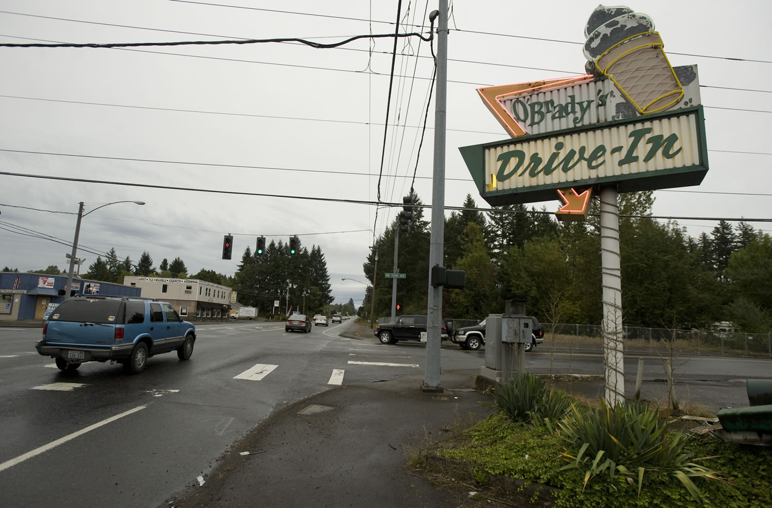 Businesses along Highway 502 near Dollars Corner, shown in 2011, are on the list of unresolved acquisitions includes the former site of O'Brady's Drive-In, which closed in 2012 amid a compensation dispute as WSDOT works to acquire at least part of the property.
