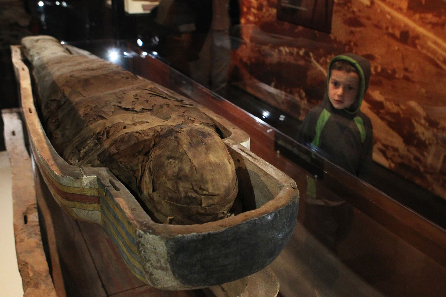 Pascual Carrasco, 4, looks up at the mummy of an Egyptian priest in the &quot;Mummies of the World&quot; exhibition at the Oregon Museum of Science and Industry. The exhibition will run through Sept.