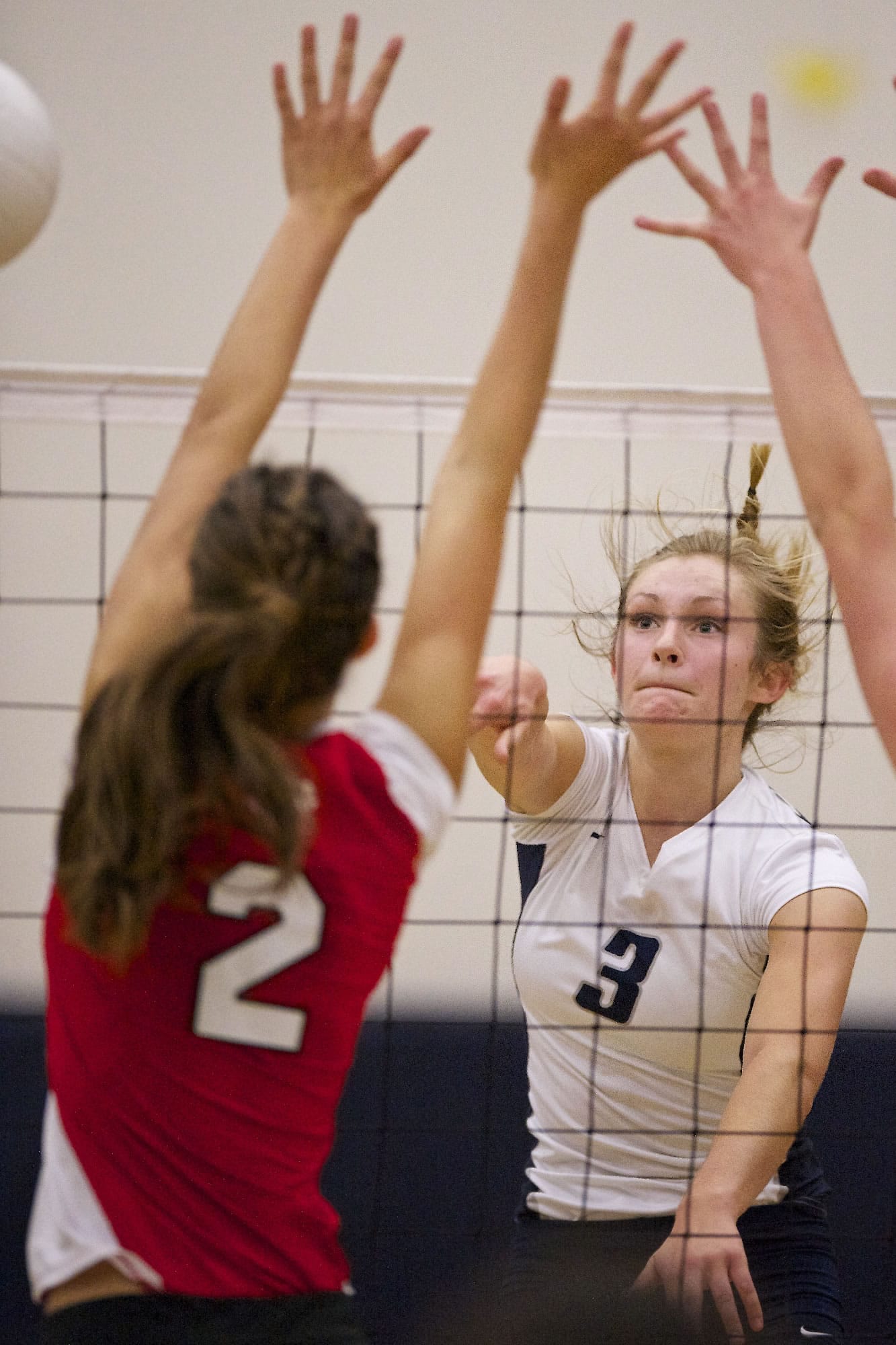 Rachel Shirley (3) of Skyview scores a point on a spike in a volleyball game against Camas.