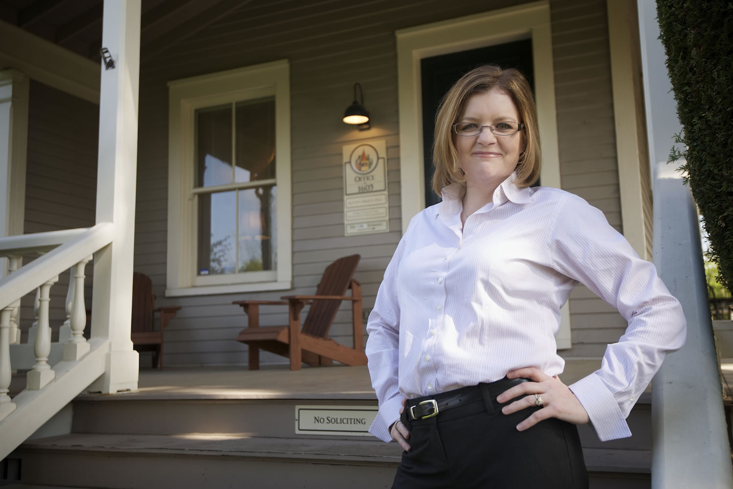 Tiffany Couch, owner of the forensic accounting firm Acuity Group, outside the company's office on Officers Row.