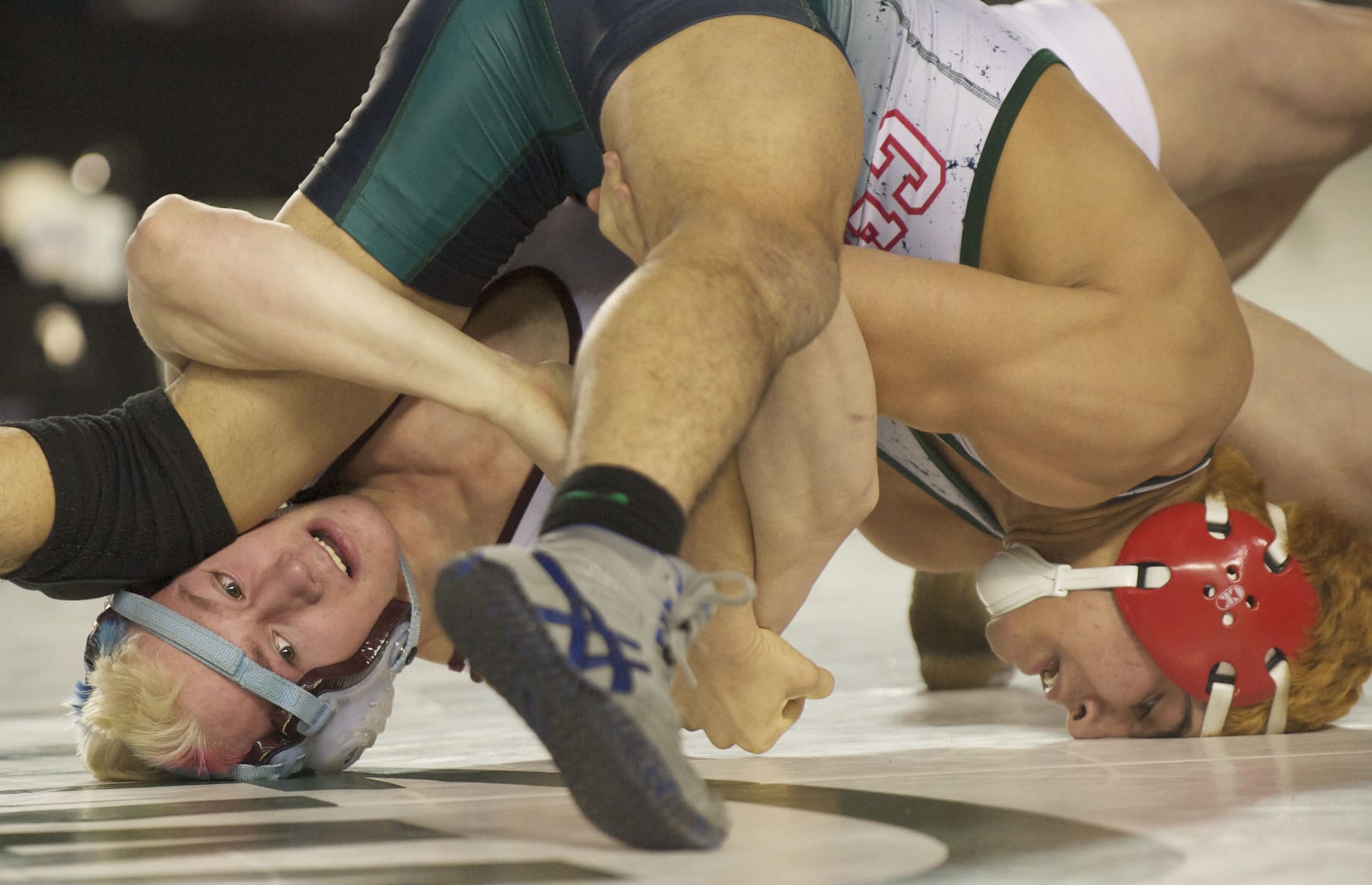 Stevenson's Tyler Miler, left,  is beaten by Erick Garcia from Chelan in the finals of the 132lb weight class of the 1A State Wrestling Tournament in Tacoma, Saturday, February 16, 2013.