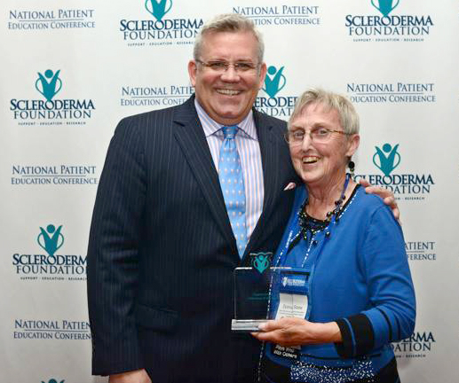Scleroderma Foundation CEO Robert Riggs, left, stands with Donna Stone of Ridgefield.