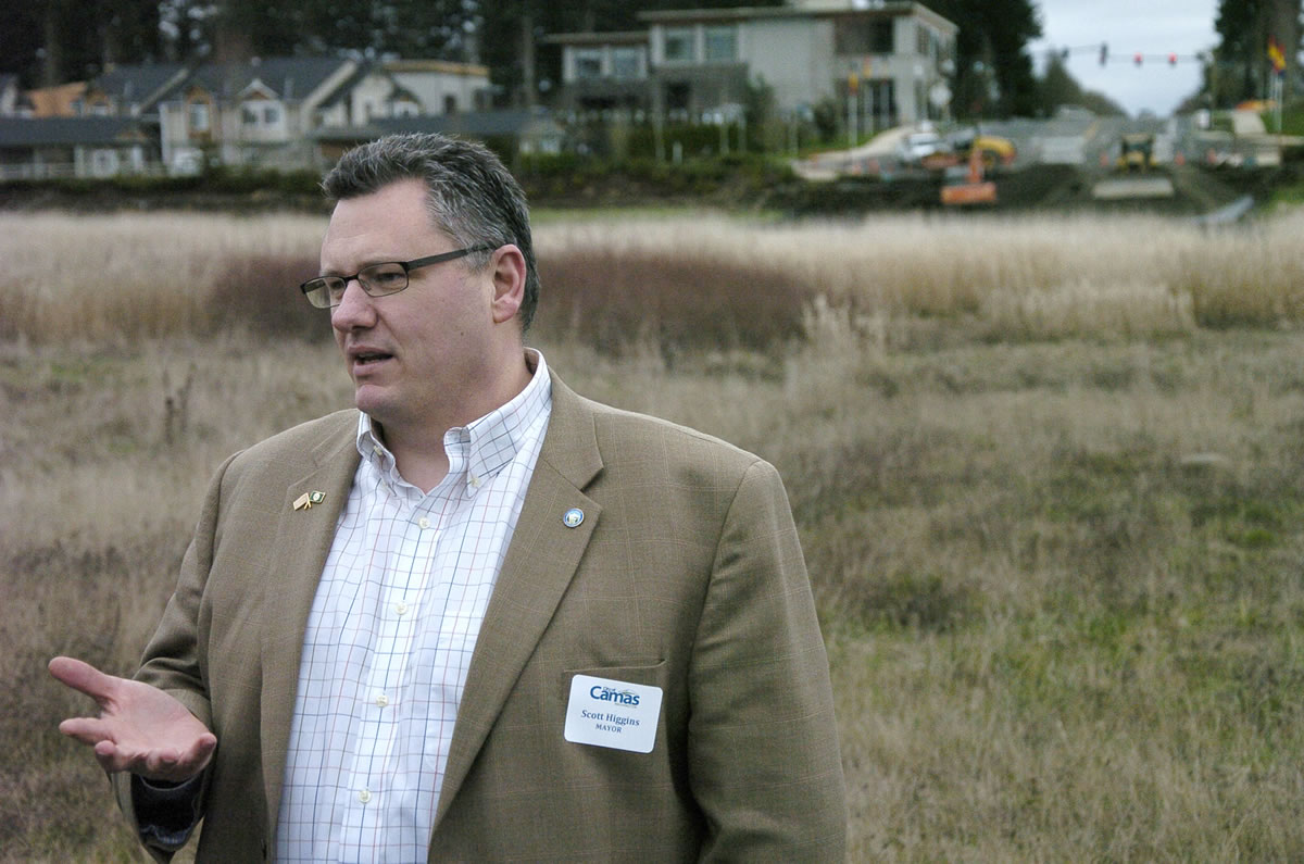 Camas Mayor Scott Higgins discusses the extension of Southeast 20th Street to Northwest 38th Avenue as workers with Tapani Inc. break ground.