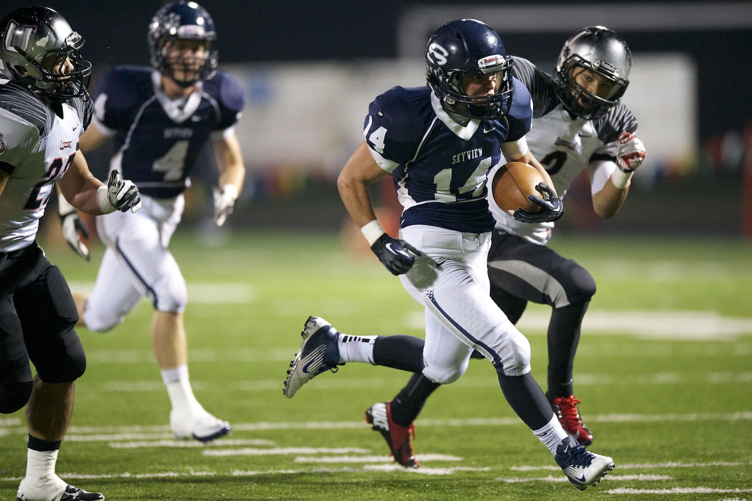 On a fourth and long Kyle Ponciano, 14, of Skyview High School breaks past Union High School defenders for a touchdown during a game at Kiggins Bowl Friday October 26, 2012 in Vancouver, Washington.