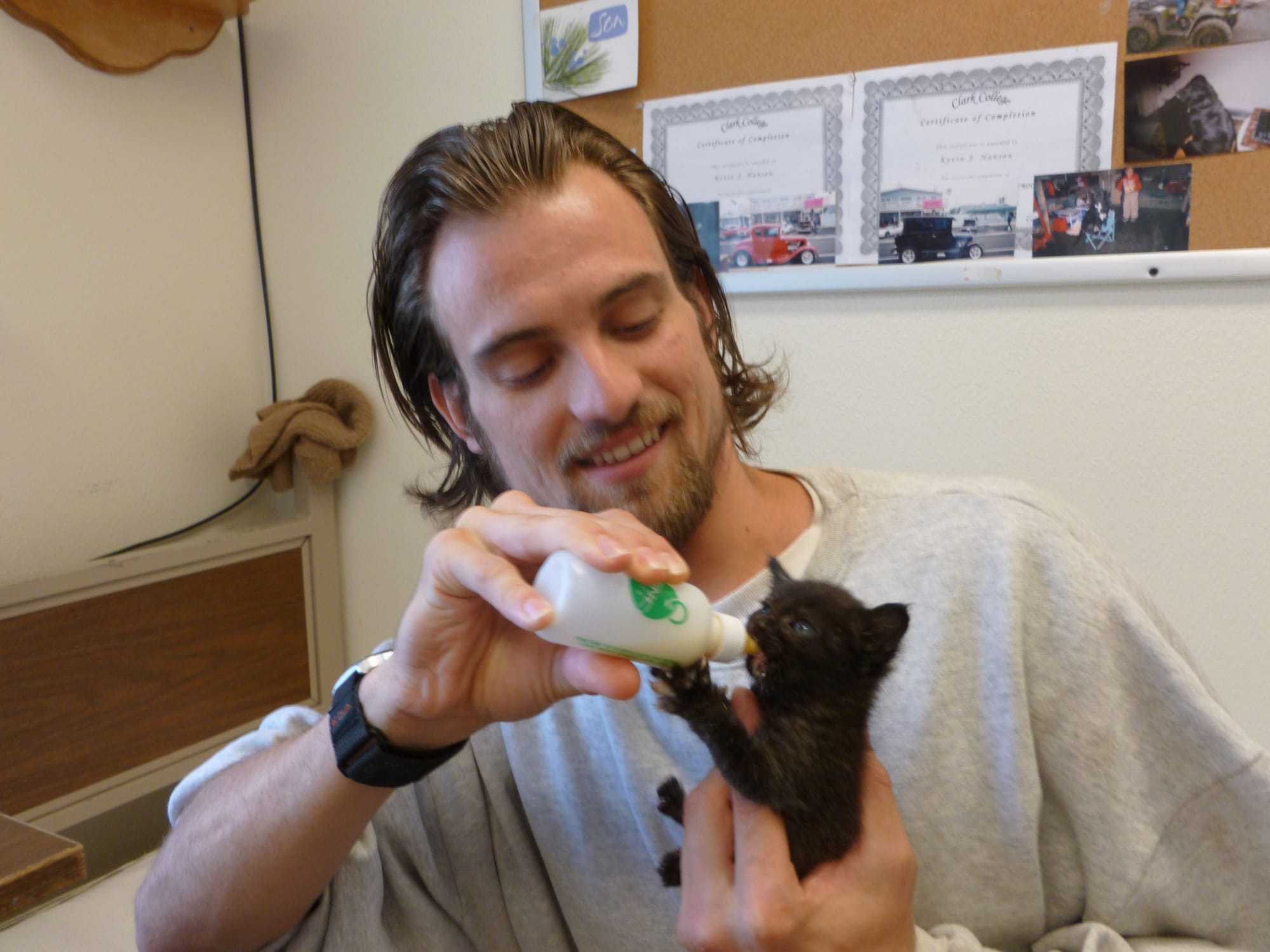 Inmate Kevin Hansen, 25, bottle feeds one of the kittens in the Cuddly Catz program at Larch Corrections Center.