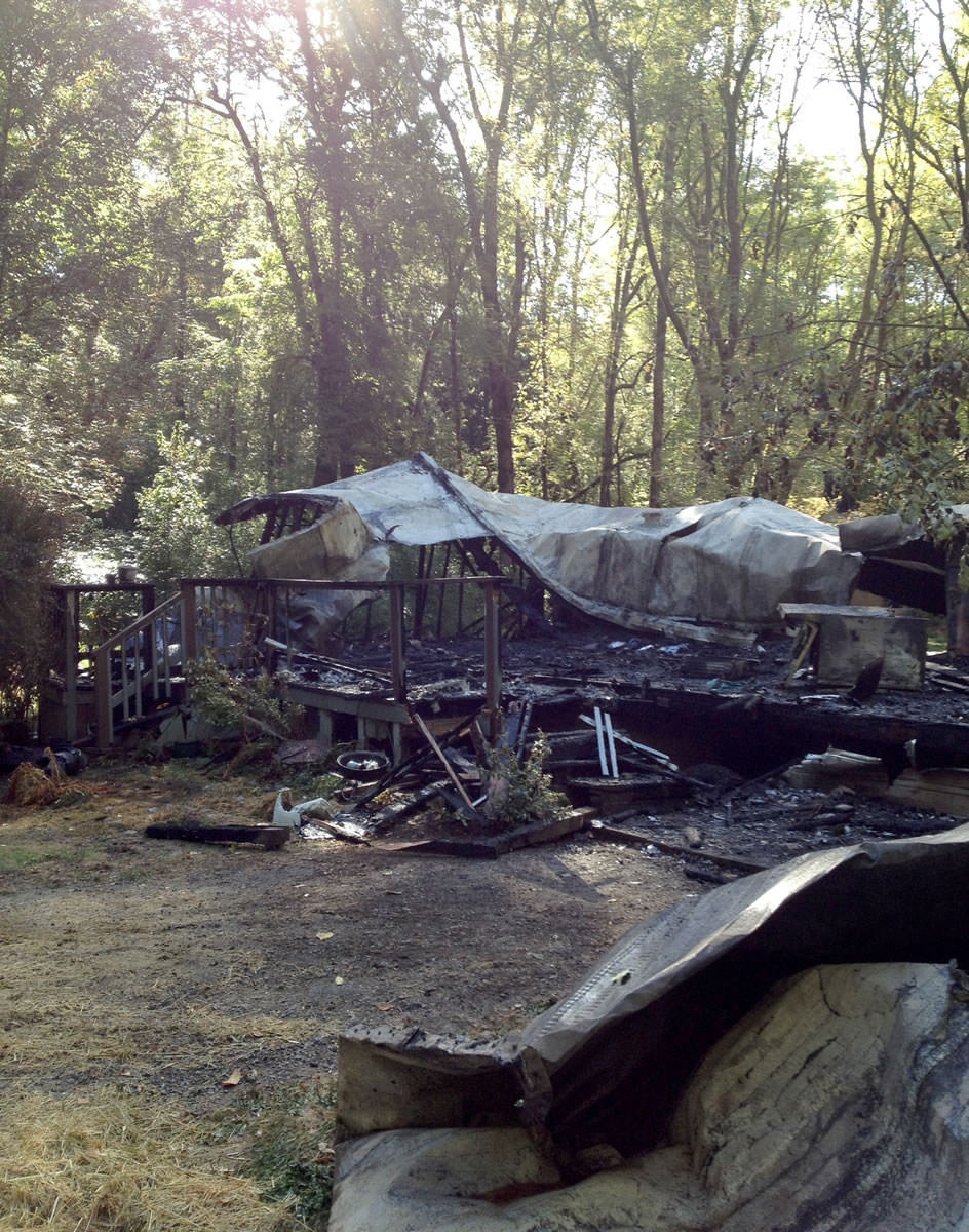 A woman escaped, but fire destroyed this mobile home in Ridgefield early Monday morning.